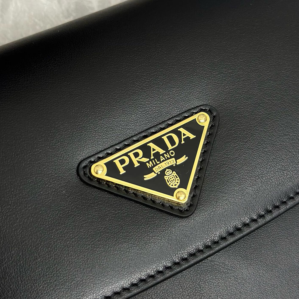 Pra*a Arque leather shoulder bag with flap